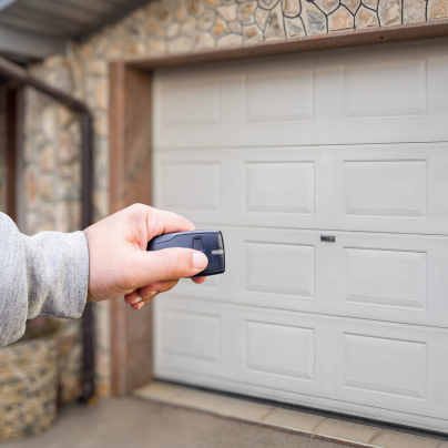 Sacramento security key fob pointing to a garage door
